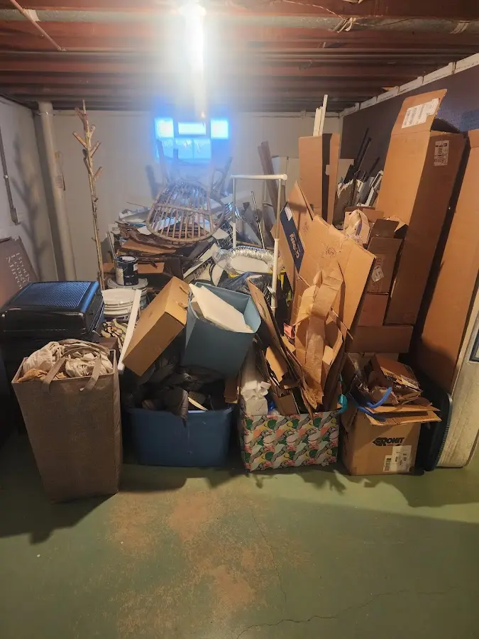 Roll-off dumpster container at job site for 2 Yard Dumpster Rental in Marquette